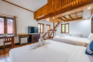 Ένα ή περισσότερα κρεβάτια σε δωμάτιο στο wisdom mystery Hotel