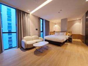 Ένα ή περισσότερα κρεβάτια σε δωμάτιο στο Tria Business & Boutique Hotel