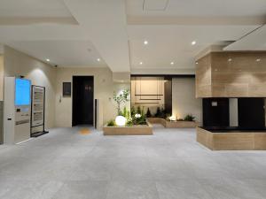 a large room with a kitchen and a living room at Tria Business & Boutique Hotel in Seoul