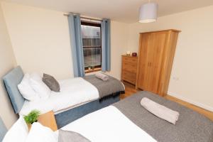 Postel nebo postele na pokoji v ubytování Harbour Point, Lerwick