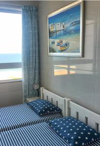 Postel nebo postele na pokoji v ubytování Afsaal Sea view apartments