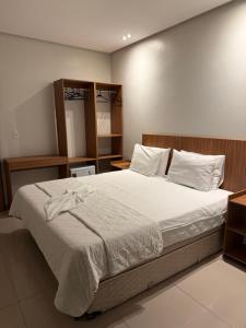 Ένα ή περισσότερα κρεβάτια σε δωμάτιο στο Hotel Mapuera