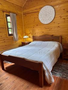 Postel nebo postele na pokoji v ubytování Cabañas del Viñedo