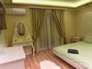 En eller flere senge i et værelse på Amazing Family Delight 2