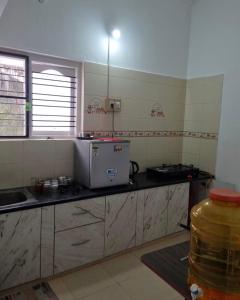 Køkken eller tekøkken på GURI Homestay + 2 billeder