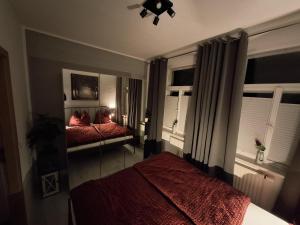 Ένα ή περισσότερα κρεβάτια σε δωμάτιο στο Ferienwohnung im Zschopauer Herzen