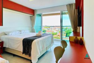 Ένα ή περισσότερα κρεβάτια σε δωμάτιο στο Fortaleza Sul Prime