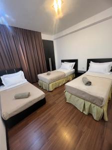 Ένα ή περισσότερα κρεβάτια σε δωμάτιο στο Likas Square Serviced Apartment - Seaview with 3bedrooms for 9pax +40 φωτογραφίες