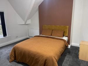 a bedroom with a large bed in a room at Princess Shahzadi in Manchester