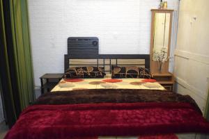 a bedroom with a large bed in a room at Men-only COZYCORNER in Lucknow