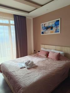 Ένα ή περισσότερα κρεβάτια σε δωμάτιο στο Milmari M9