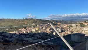 a view of a city from the top of a hill at Agherè in Agira +1 photo