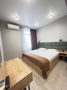 Ένα ή περισσότερα κρεβάτια σε δωμάτιο στο Апарт-отель Nine Rooms