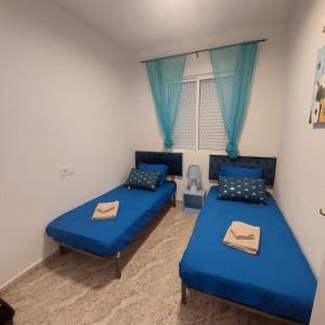 Ένα ή περισσότερα κρεβάτια σε δωμάτιο στο CASA LUTHI Costa Blanca