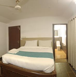 Ένα ή περισσότερα κρεβάτια σε δωμάτιο στο Mia Riaan Lake View Resort