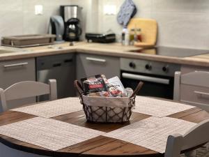 a basket of food sitting on a table in a kitchen at Eftyhia's Cozy apartment Patmos in Skala +8 photos