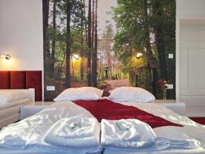 Postel nebo postele na pokoji v ubytování Janowski Zakątek