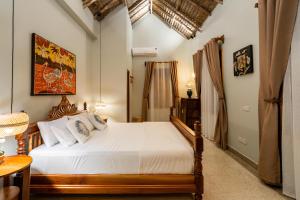a bedroom with a large bed in a room at Villa Fika in Dar es Salaam