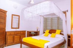 Ένα ή περισσότερα κρεβάτια σε δωμάτιο στο Precious Furaha Homes