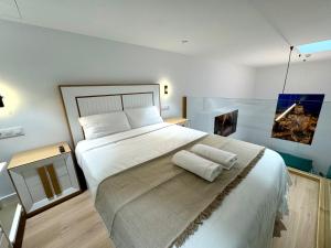 Ένα ή περισσότερα κρεβάτια σε δωμάτιο στο Premium Plaza San Cristóbal - Gran Vía Centro