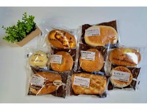 a bunch of different types of food in plastic bags at Grampus Inn Osaka Namba in Osaka +32 photos