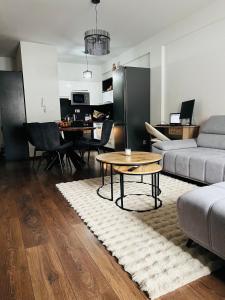 a living room with a couch and a table at Zilina Sweet Escape in Žilina