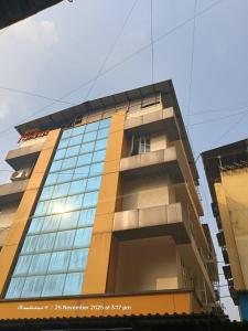 a tall building with a lot of windows at Hotel Signature in Thane