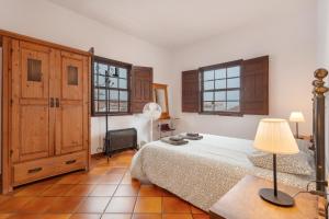 Postel nebo postele na pokoji v ubytování La Casa De Vilaflor