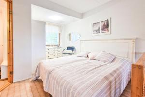 En eller flere senge i et værelse på Lomahuoneisto Ukonpuoti 15-16