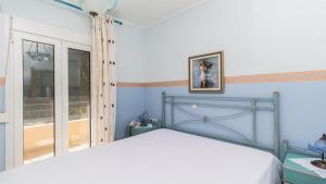 Ένα ή περισσότερα κρεβάτια σε δωμάτιο στο Xenius Zeus Sea View Maisonette in Glarokamvos I