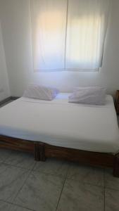 Ένα ή περισσότερα κρεβάτια σε δωμάτιο στο Carol's Home