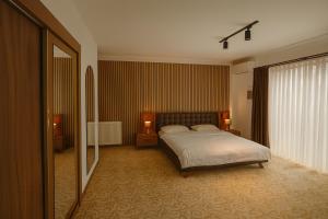 Ένα ή περισσότερα κρεβάτια σε δωμάτιο στο My Suit Residence & Hotel