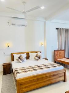 Ένα ή περισσότερα κρεβάτια σε δωμάτιο στο Crossing Royal