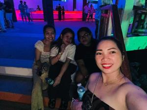 a group of people posing for a picture at a party at Maui's Place in Badian