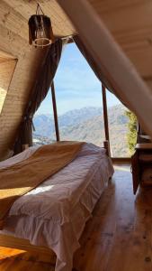 Una cama o camas en una habitación de GREEN GUNDAURI