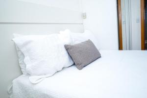 En eller flere senge i et værelse på Life Resort - Temporada