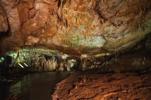 a cave with a pool of water in it at Kera Ethno Hotel in Gvishtibi