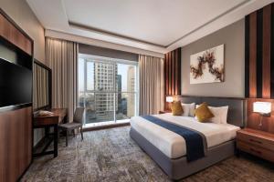 En eller flere senge i et værelse på Myrtle Tower AlSahafa Hotel فندق برج ميرتل الصحافه + 43 billeder