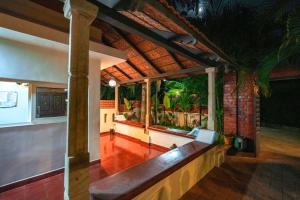 a living room with a bench in a house at Mount Retreat Resorts - Madurai in Madurai