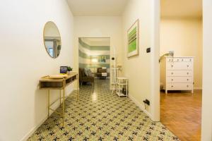 a hallway with a room with a dresser and a mirror at CasaViva - Bilo in Camogli with Parking & Shared Pool in Camogli +10 photos