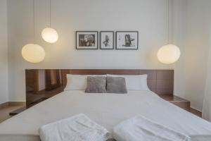 En eller flere senge i et værelse på Casa Jimena