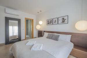 Postel nebo postele na pokoji v ubytování Casa Jimena