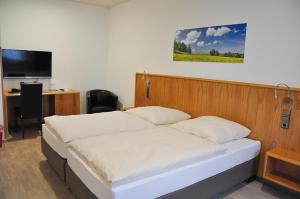 Postel nebo postele na pokoji v ubytování Garni Hotel Alber