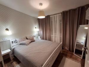 Ένα ή περισσότερα κρεβάτια σε δωμάτιο στο Tammiku apartment