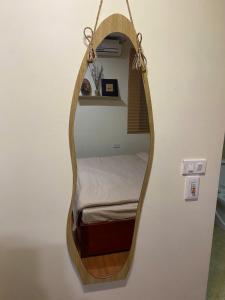 a room with a bed in a hanging bed frame at SaPa Global Hotel in Sapa
