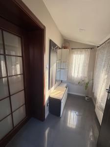 a bathroom with a sink and a toilet in it at Pasarel House in Pasarel