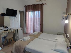 Postel nebo postele na pokoji v ubytování Hotel Isidora