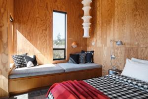 a bedroom with a bed and a window at Wild Meadow in Sea Ranch +30 photos