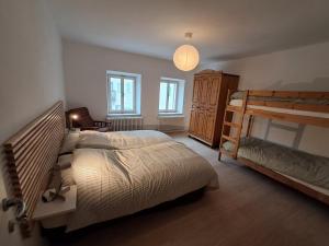 a bedroom with two beds and a bunk bed at La Casa di Elvira-Primo Piano in Piaia +8 photos