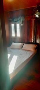 Ένα ή περισσότερα κρεβάτια σε δωμάτιο στο Mr Thành Homestay- paper village